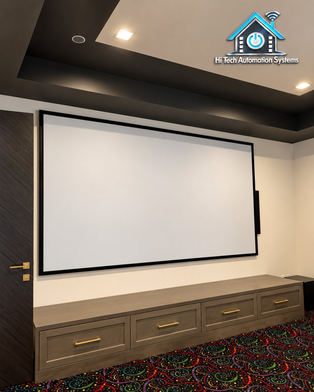 Dedicated home theater with a large projection screen, dark ceiling, built-in cabinetry and patterned carpet.